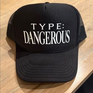 Mariah Carey’s Type: Dangerous Black Trucker Hat with Bold Text